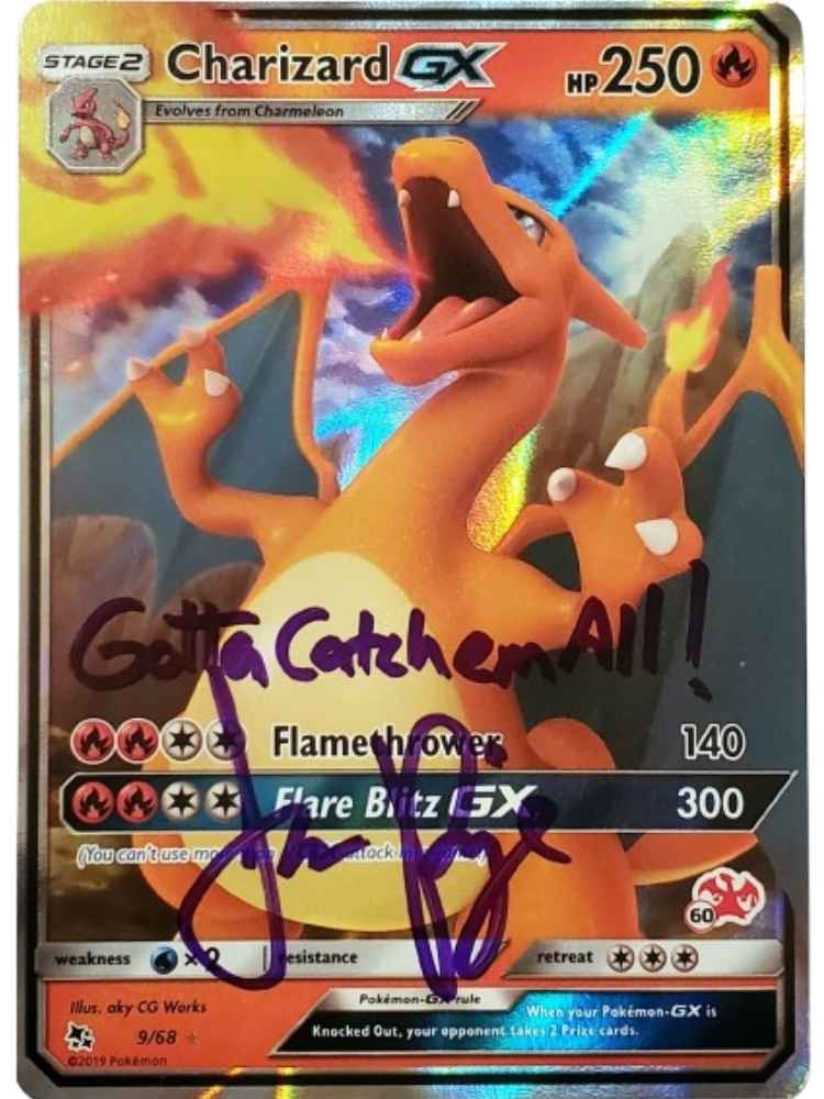 Pokémon trading card featuring Charizard GX with 'Gotta Catch'em All!' text and JP Signed