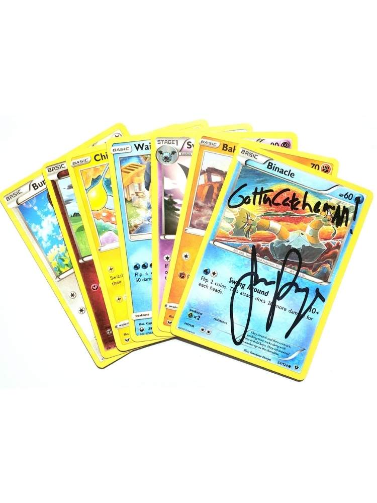 Collection of trading cards with a signature of JP on them, on a white background