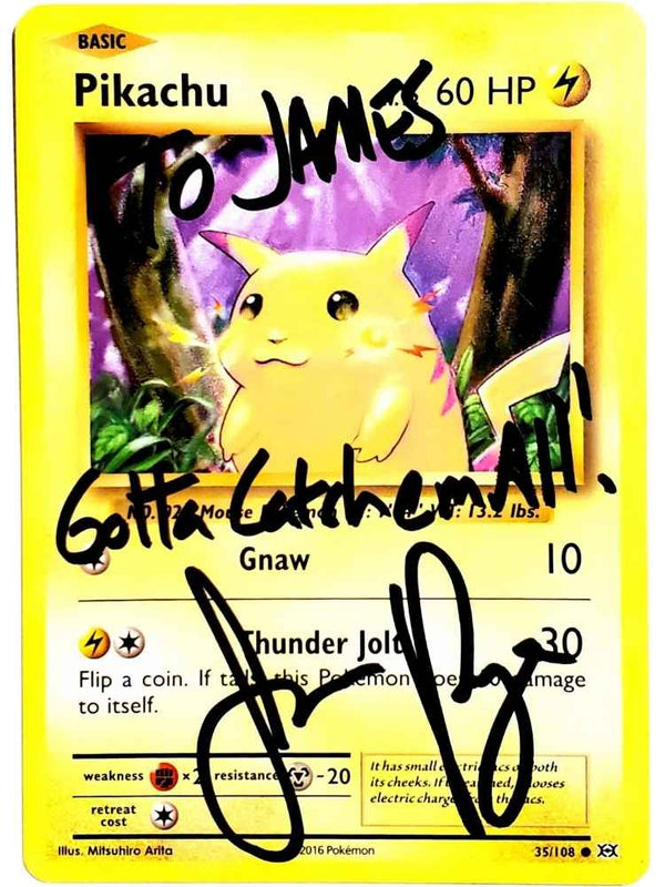 JP Signed Pikachu trading card with text on a yellow border