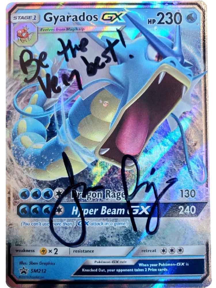 Pokémon trading card with 'Gyarados GX' and Autographed by JP on a colorful background