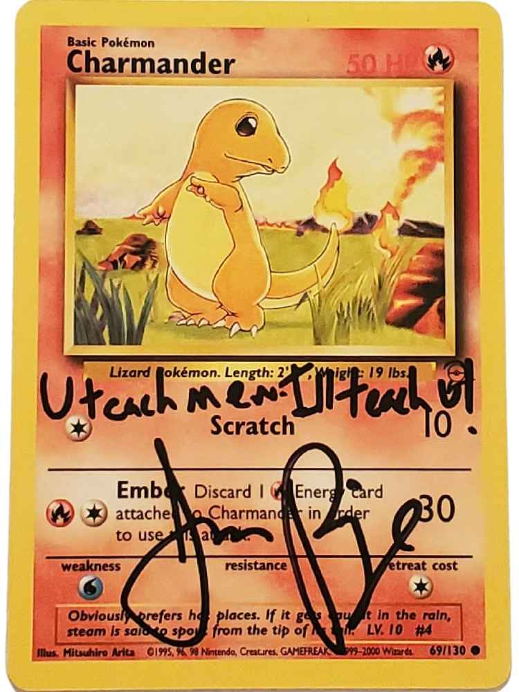 Pokémon Charmander trading card with handwritten text and signature of JP