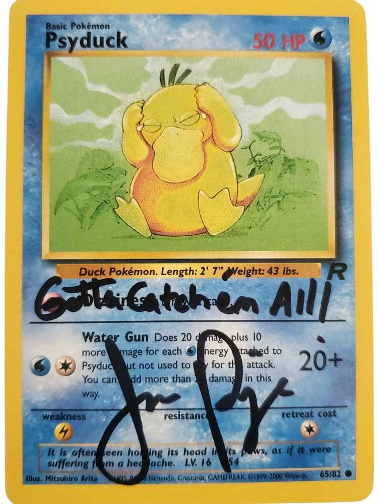 Trading card featuring Psyduck with handwritten text and Autographed by JP