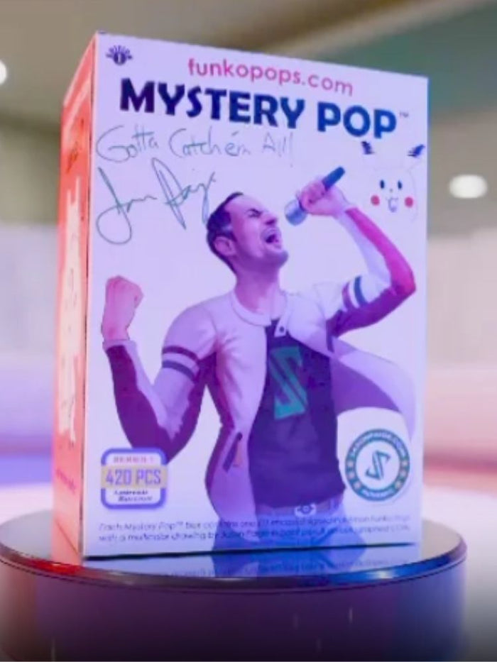 Funko Pop! Mystery Pop packaging with JP holding a microphone on a reflective surface.