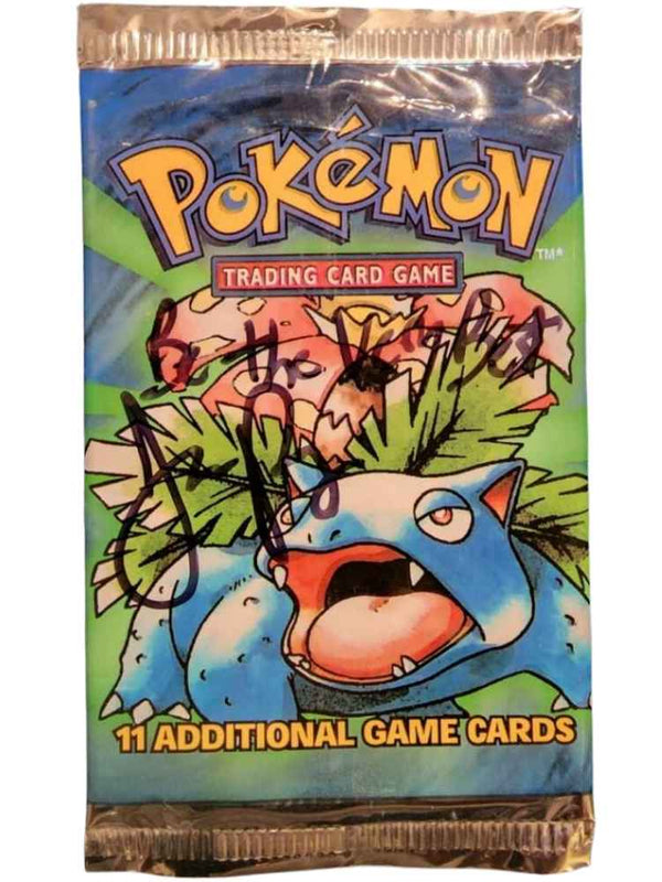 A signed Pokémon WOTC Base Set Unlimited Wrapper featuring the Bulbasaur card, with an autograph by Jason Paige.